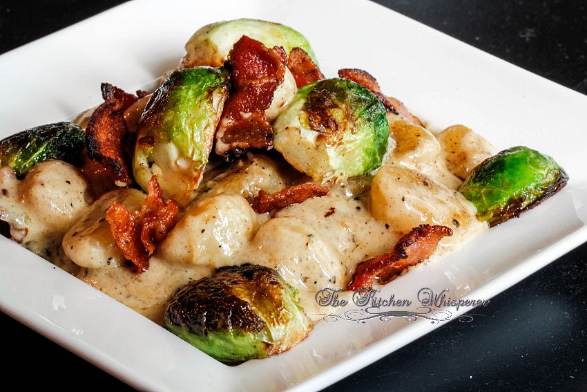 One of the best gnocchi dishes you'll ever have! Tender potato gnocchi in a bacon cream sauce, crispy bacon and roasted Brussels Sprouts.