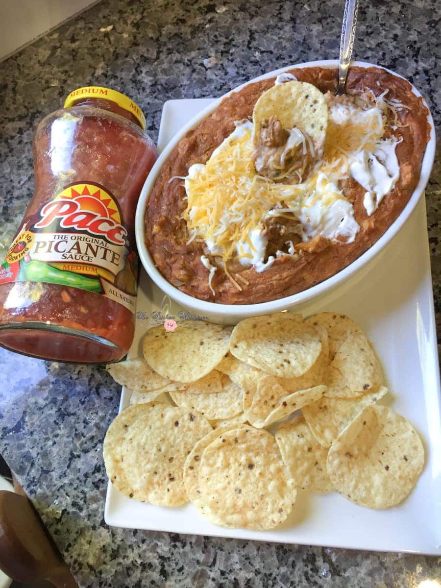 This is the ULTIMATE Bean Dip! Double beans, 3 types of cheese, picante sauce and spices!