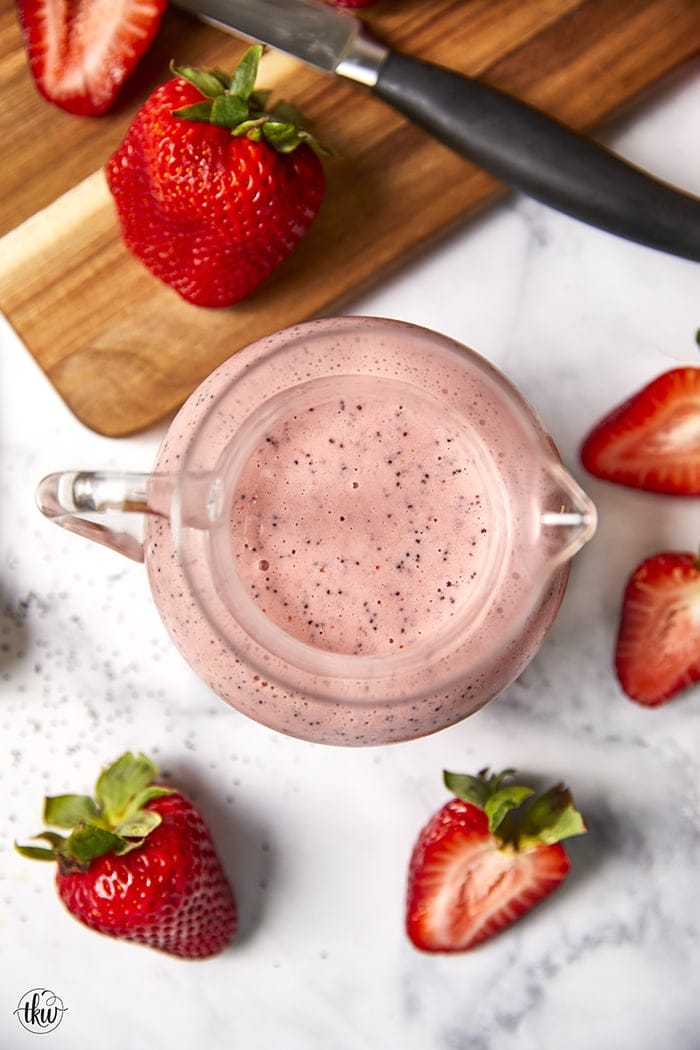 Lighten up your summer salads with this refreshing and delicious Strawberry Poppy Seed Vinaigrette! Find out the secret to making this creamy without any dairy!