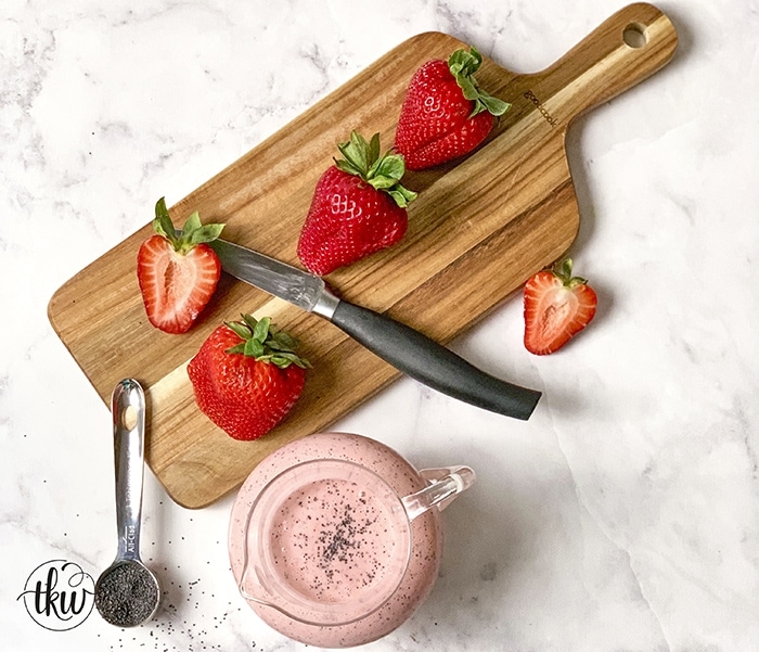 Lighten up your summer salads with this refreshing and delicious Strawberry Poppy Seed Vinaigrette! Find out the secret to making this creamy without any dairy!