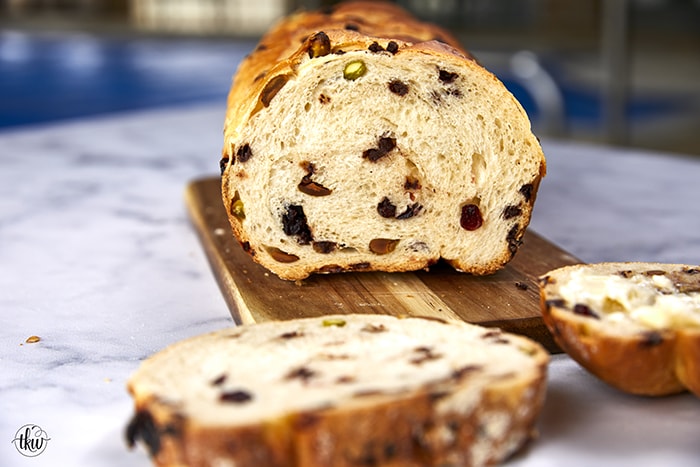 This Artisan Cranberry Pistachio Chocolate Chip Bread is a bread lover's dream! Slightly sweet & salty that's perfect for morning toast or for one amazing sandwich. Bakery style bread from scratch!