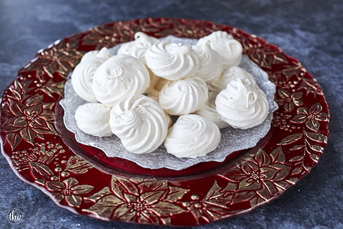 These French Vanilla Meringue Sandwich Cookies with Ganache filling are cloud-like treats that melt in your mouth with a slightly crisp outer shell, a slightly chewy center, and a decadent chocolate ganache filling.