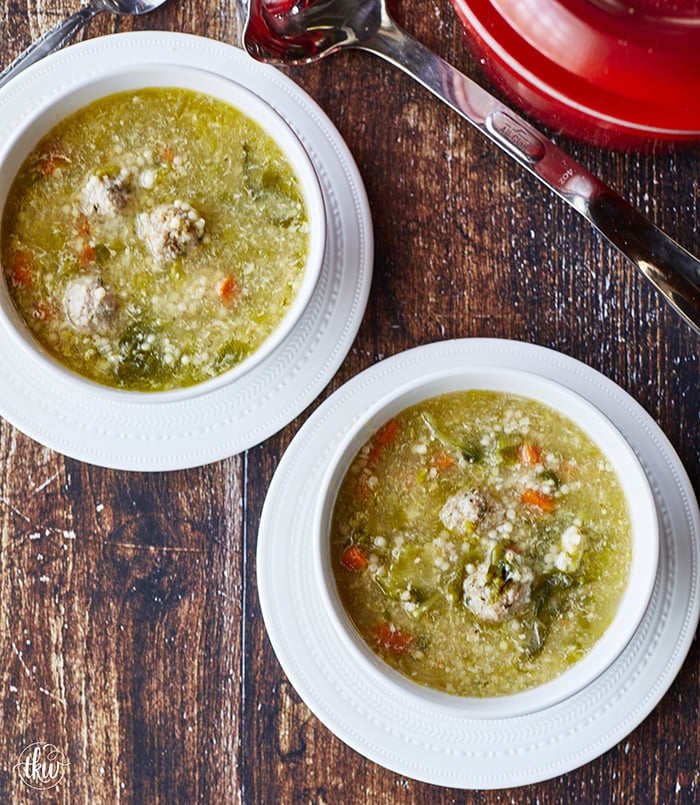This Authentic Italian wedding soup is like a bowl of pure comfort and a hug from an Italian Nonna! Mini meatballs, escarole, carrots, and acini di pepe pasta make this the best anytime soup!