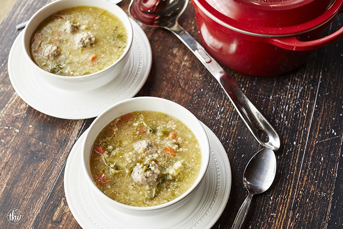 This Authentic Italian wedding soup is like a bowl of pure comfort and a hug from an Italian Nonna! Mini meatballs, escarole, carrots, and acini di pepe pasta make this the best anytime soup!