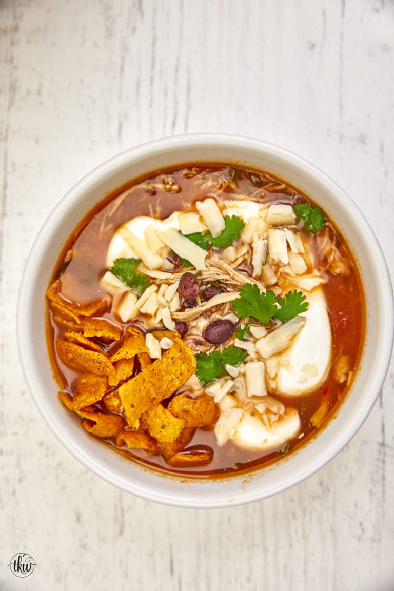 This soup features seasoned Mexican shredded chicken, beans, jalapenos, fresh herbs, smoky tomato broth, and a hint of lime making it the perfect soup on a chilly day. Chicken Tortilla Soup, best chicken tortilla soup recipe, Mexican chicken tortilla soup, easy chicken tortilla soup, classic chicken tortilla soup, white chicken tortilla soup, authentic chicken tortilla soup