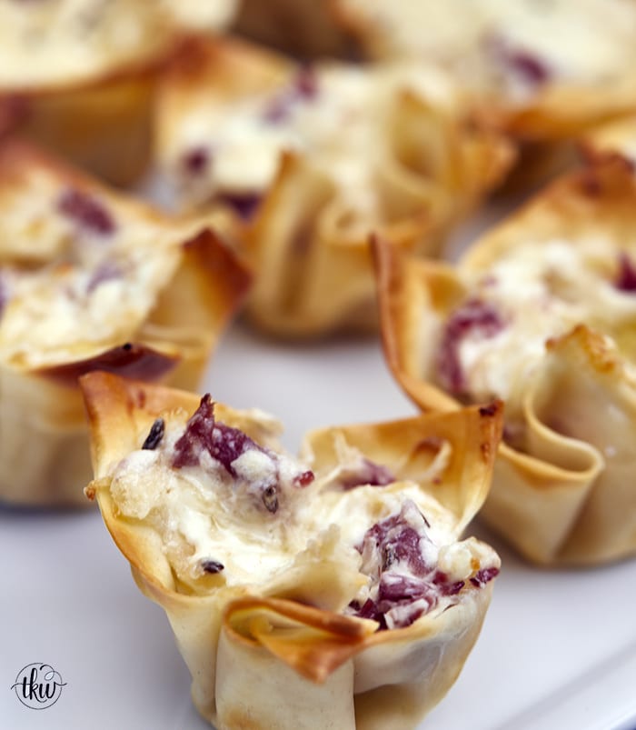 These crispy baked wonton shells are stuffed with cheesy corned beef & sauerkraut filling making them the perfect St. Patrick's day appetizer! Cheesy Reuben Wontons, wonton cups, baked wontons, leftover corned beef, St. Patrick's day appetizers, crispy baked wontons, cheesy Reubens