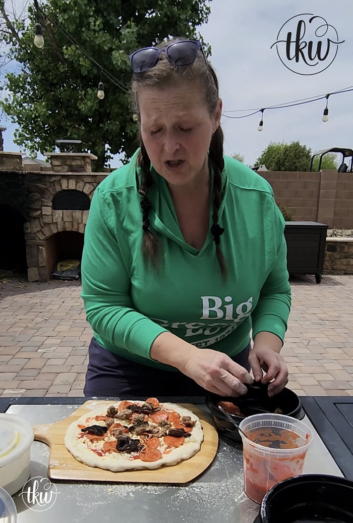 With over 35 years of professional experience, I'm sharing stretching tips, dough techniques, and pizza knowledge on becoming your own EGGspert pizzaiolo! A Pizzaiola's Guide To Pizza on The Big Green Egg, grilled pizza, pizza on the grill, how to make pizza on a grill, cooking pizza on big green egg conveggtor, backyard pizzaiolo, pizza stone, indrect heat pizza