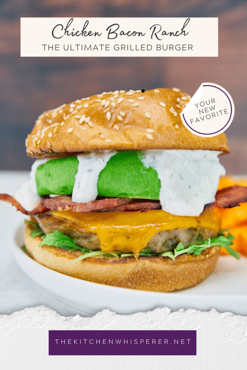 Say hello to your new favorite burger! Ground bacon & seasonings are mixed with ground chicken to make this the ultimate grilled burger! Top with melted cheese, arugula, crispy bacon, and parmesan ranch for absolute deliciousness! Ultimate Ground Chicken Bacon Ranch Burger, crack chicken burger, ground bacon burger, ranch chicken burgers, ultimate chicken burger, best chicken burger