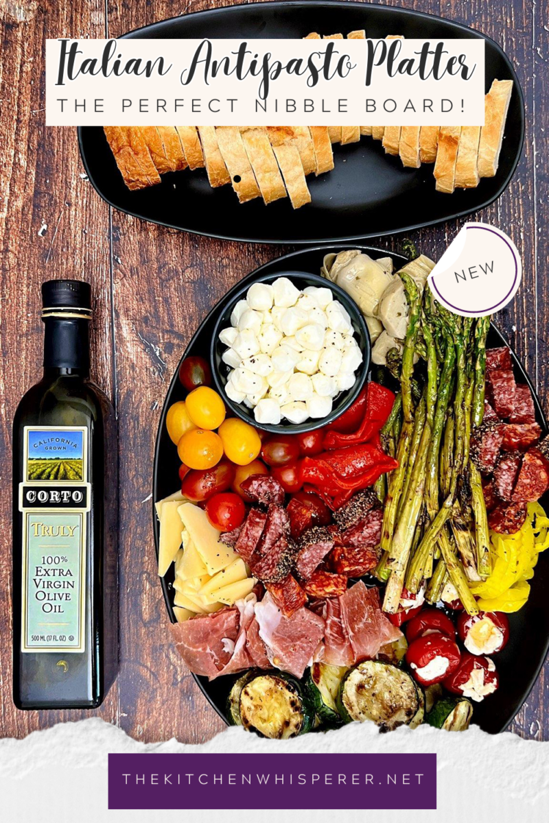 A delicious combination of Italian meats, cheeses, and grilled veggies drizzled in a zesty Italian vinaigrette. It's the perfect nibble board to gather around and takes mere minutes to put together! How to Make an Italian Antipasto Grazing Platter, antipasto platter ideas, best antipasto platter, easy antipasto, italian appetizer, antipasti, grazing board, italian charcuterie