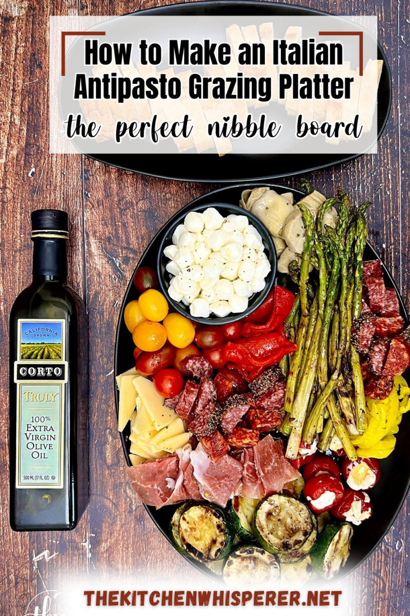 A delicious combination of Italian meats, cheeses, and grilled veggies drizzled in a zesty Italian vinaigrette. It's the perfect nibble board to gather around and takes mere minutes to put together! How to Make an Italian Antipasto Grazing Platter, antipasto platter ideas, best antipasto platter, easy antipasto, italian appetizer, antipasti, grazing board, italian charcuterie