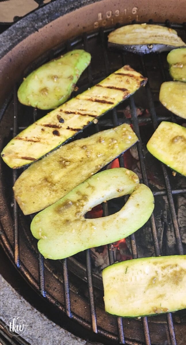 Perfectly grilled zucchini, chayote, and eggplant on a garlic butter grilled bun topped with grilled cheesy heirloom tomatoes and Italian herb oil.
