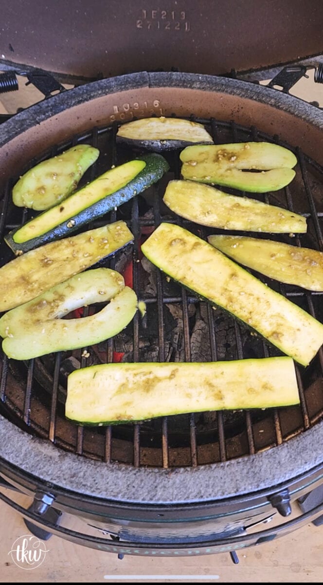 Perfectly grilled zucchini, chayote, and eggplant on a garlic butter grilled bun topped with grilled cheesy heirloom tomatoes and Italian herb oil.
