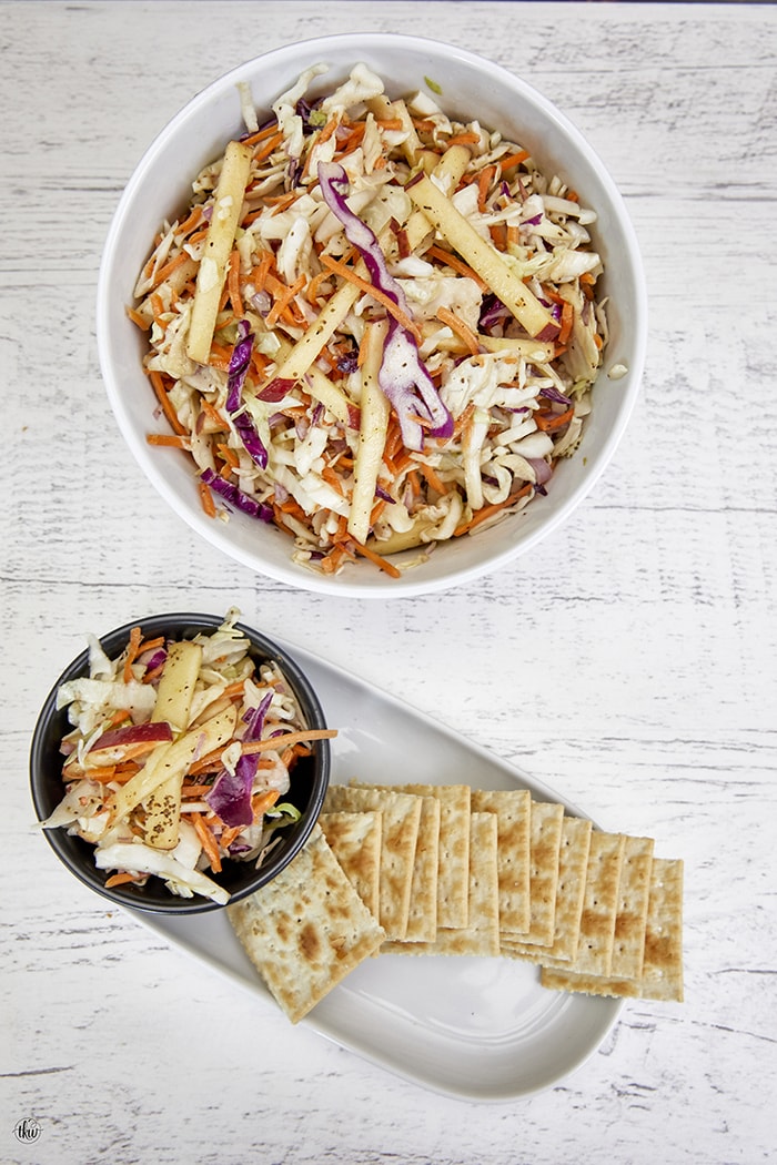 Crisp apples and crunchy slaw mixed gently and then coated in a honey dijon vinaigrette make this perfect for any season. Fall Apple Coleslaw With A Honey Dijon Vinaigrette, no may coleslaw, football foods, pulled pork, pulled chicken, sandwiches, tailgate food, gluten free recipes, cabbage slaw, apple salad, cabbage salad