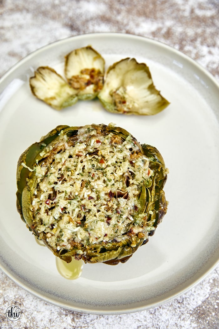 This crowd-favorite recipe is Nonna approved and loved by all. It's loaded with cheese, olive oil, and herbs making this one of the best ways to kick off a special meal, pasta night, or impress your guests! The Best Cheesy Italian Stuffed Artichokes, Best Ever Stuffed Artichokes, Nonna Artichokes, Sunday Artichokes, Steamed Artichokes, Gluten Free Italian Artichokes, old fashioned Italian stuffed artichokes, how to make stuffed artichokes italian style
