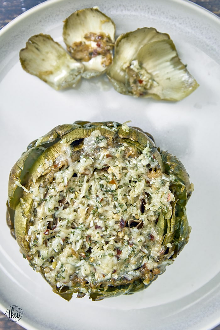 This crowd-favorite recipe is Nonna approved and loved by all. It's loaded with cheese, olive oil, and herbs making this one of the best ways to kick off a special meal, pasta night, or impress your guests! The Best Cheesy Italian Stuffed Artichokes, Best Ever Stuffed Artichokes, Nonna Artichokes, Sunday Artichokes, Steamed Artichokes, Gluten Free Italian Artichokes, old fashioned Italian stuffed artichokes, how to make stuffed artichokes italian style
