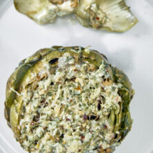 This crowd-favorite recipe is Nonna approved and loved by all. It's loaded with cheese, olive oil, and herbs making this one of the best ways to kick off a special meal, pasta night, or impress your guests! The Best Cheesy Italian Stuffed Artichokes, Best Ever Stuffed Artichokes, Nonna Artichokes, Sunday Artichokes, Steamed Artichokes, Gluten Free Italian Artichokes, old fashioned italian stuffed artichokes, how to make stuffed artichokes italian style