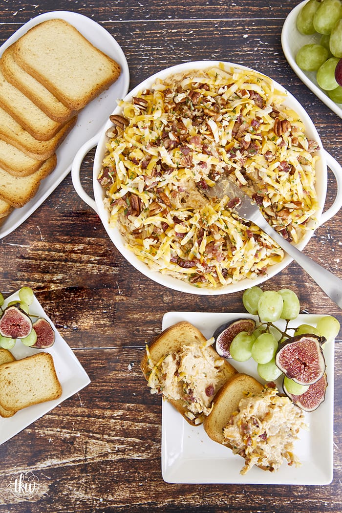 Whether it’s for tailgating or hosting a party, this dip is the perfect fall recipe! Shape it as a cheese ball for a cold appetizer or bake it for an over-the-top cheesy dip! Easy Cheesy Caramelized Onion and Bacon Dip with Apple Butter, apple butter cheese ball, onion bacon cheese ball, tailgating foods, hot cheesy dip, hot apple butter dip, savory onion dip