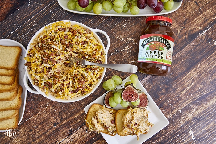 Whether it’s for tailgating or hosting a party, this dip is the perfect fall recipe! Shape it as a cheese ball for a cold appetizer or bake it for an over-the-top cheesy dip! Easy Cheesy Caramelized Onion and Bacon Dip with Apple Butter, apple butter cheese ball, onion bacon cheese ball, tailgating foods, hot cheesy dip, hot apple butter dip, savory onion dip