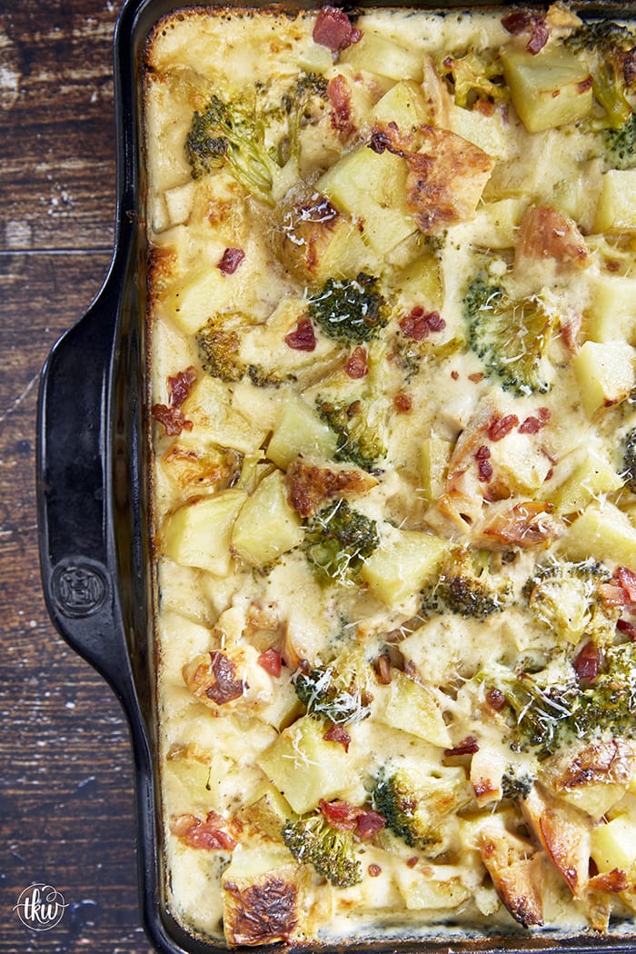 This has to be one of THE BEST one-pan recipes! Tender potatoes, broccoli, roasted chicken, and crispy bacon smothered in a cheesy Parmesan Alfredo sauce! Smothered Alfredo Chicken Casserole With Potatoes Bacon And Broccoli, smothered chicken, chicken casserole, one pan dinner, leftover chicken recipes, parmesan alfredo cheese sauce, comfort foods