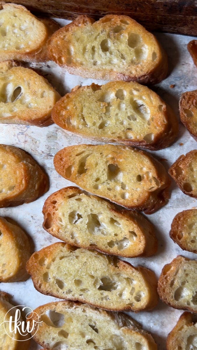 Making crostini from scratch is super easy and is so inexpensive. Stop buying premade stuff and start making it homemade! It's the perfect appetizer base and soup dipper! The Best & Easiest Homemade Crostini, appetizer toast, easy toast, french baguettes, crunchy bread, crispy bread