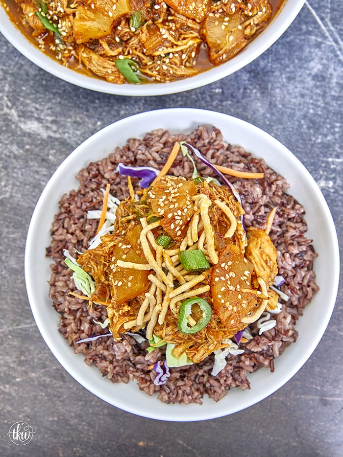 Tender shredded chicken bathed in a sweet & spicy BBQ sauce with bits of pineapple, mandarin oranges, and red onions make this an unforgettable and delicious recipe. Perfect for a quick weeknight dinner, wrap filling, nacho topping, or weekly meal prep protein! BBQ Hawaiian Shredded Chicken In The Instant Pot, pineapple chicken, sweet and spicy chicken, orange chicken, meal prep chicken, bbq chicken, pulled chicken, chicken wraps, chicken nachos, tangy bbq chicken