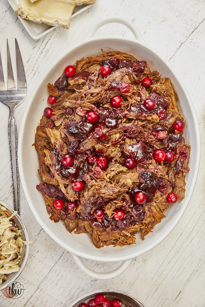 'Tis the season for all things delicious! Pairing tart cranberries with smoky chipotle peppers and a Sweet Heat BBQ Sauce makes this one of the best pulled pork recipes ever! Plus it is made in the Instant Pot! Ultimate Cranberry Chipotle BBQ Pulled Pork, sweet & spicy pulled pork, best pulled pork, instant pot pulled pork, slow cooker pulled pork, bbq pulled pork