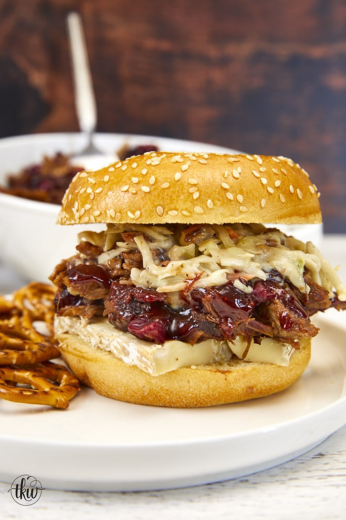 'Tis the season for all things delicious! Pairing tart cranberries with smoky chipotle peppers and a Sweet Heat BBQ Sauce makes this one of the best pulled pork recipes ever! Plus it is made in the Instant Pot! Ultimate Cranberry Chipotle BBQ Pulled Pork, sweet & spicy pulled pork, best pulled pork, instant pot pulled pork, slow cooker pulled pork, bbq pulled pork