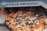 Authentic wood-fired pizzeria-style pizza made in your Yoder Smokers Pizza Oven. This is the must-have accessory for your Yoder Smoker! Don’t have a Yoder? Upgrade today! Authentic Pizzeria Style Pizza Made In The Yoder Smokers Pizza Oven, YS640 pizza oven, pellet smoker pizza, pellet grill pizza, backyard pizza, smoked pizza