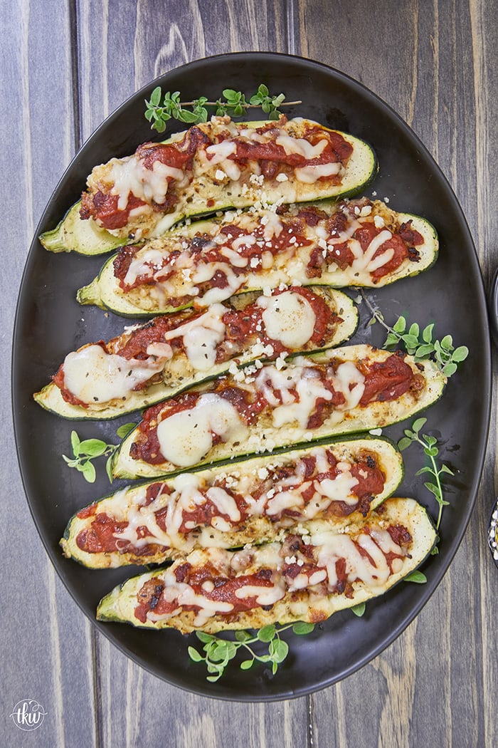 Looking for a mouthwatering and crave-worthy meal that is both gluten-free and keto-friendly without sacrificing flavor? Get ready to indulge in a dish that's bursting with cheesy Italian flavors, easy to make, and delicious! Easy Sheet Pan Smoked Italian Sausage Ricotta Zucchini Boats, gluten-free recipes, keto-friendly dinner recipe, stuffed zucchini, yoder smokers pizza oven, meal prep recipes, easy italian zucchini