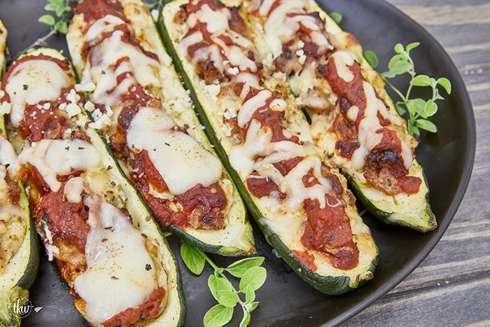 Looking for a mouthwatering and crave-worthy meal that is both gluten-free and keto-friendly without sacrificing flavor? Get ready to indulge in a dish that's bursting with cheesy Italian flavors, easy to make, and delicious! Easy Sheet Pan Smoked Italian Sausage Ricotta Zucchini Boats, gluten-free recipes, keto-friendly dinner recipe, stuffed zucchini, yoder smokers pizza oven, meal prep recipes, easy italian zucchini