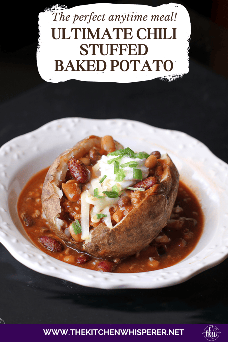 Perfectly baked potatoes fluffed up and stuffed with chili (bean or beanless), topped with 2 types of cheese, sour cream, and chives for the perfect anytime meal! Ultimate Loaded Chili Stuffed Baked Potatoes, chili baked potatoes, baked potatoes with chili, ways to use chili, ways to use up baked potatoes, baked potato bar, easy dinners, loaded baked potatoes