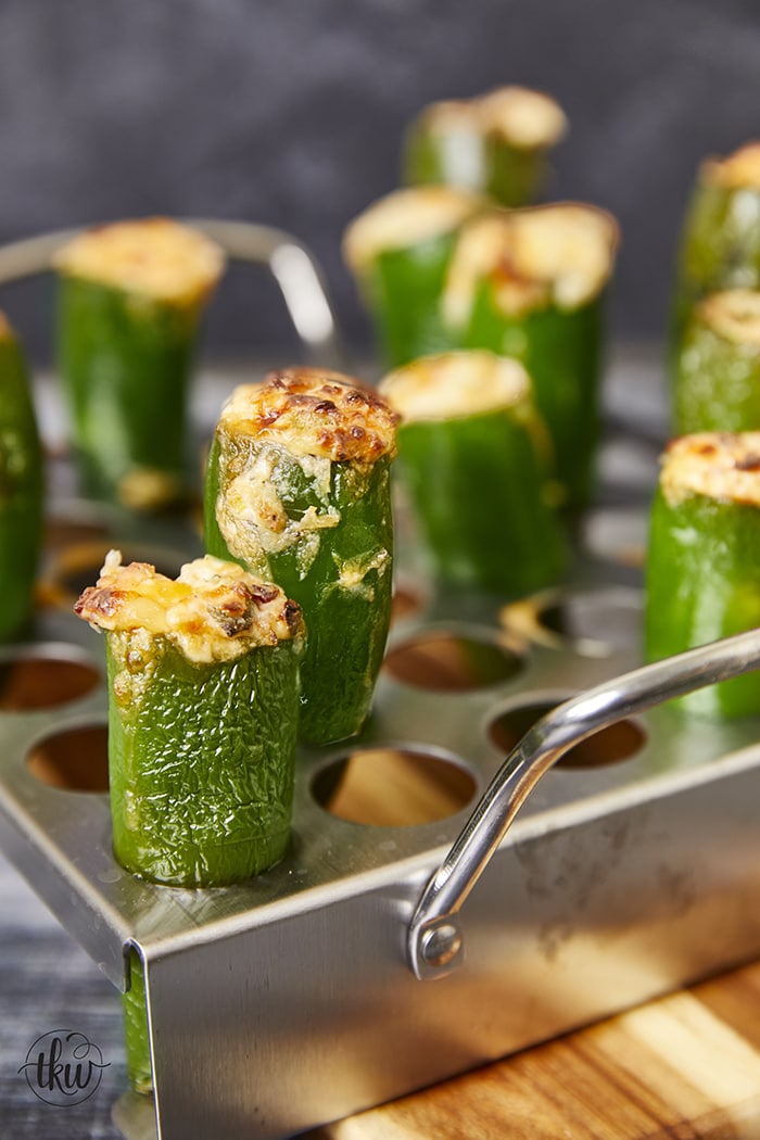 Get ready to tantalize your taste buds with a fiery explosion of flavor! Flame-kissed cheesy jalapeño poppers, oozing with melted cheese and savory bacon, are always a huge crowd favorite. Elevate Your Grill Game with Flame Kissed Cheesy Jalapeño Poppers, stuffed jalapeno peppers, cheesy peppers, game day appetizers, cheese filled jalapeno peppers, football foods