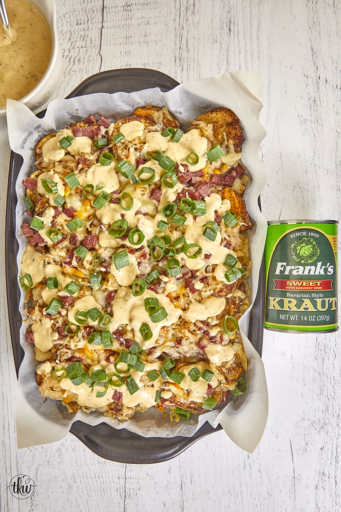 Pub-Style Irish Nachos are crispy thin potatoes topped with 3 types of cheeses, corned beef, sauerkraut, green onions and beer cheese. Ultimate Crunchy Pub Grub: Crispy Potato Sauerkraut Irish Nachos, corned beef and sauerkraut, crispy potato nachos, cheesy potatoes, baked cheesy potatoes, sauerkraut