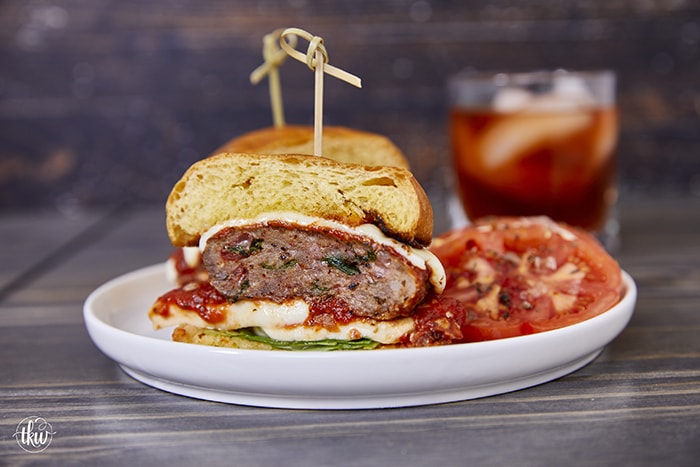 Mouth-watering and packed with flavor, these crafted loaded Italian sausage and beef burgers are elevating burger night! Stuffed with roasted red peppers, gooey cheese, and fresh spinach, these burgers make every bite a mouthwatering masterpiece! Ultimate Loaded Italian Sausage & Beef Burgers, sausage burgers, mozzarella burgers, Crafted burger recipe, Ultimate Burger, Grilled Burgers, Double Meat Burgers, best burger recipe