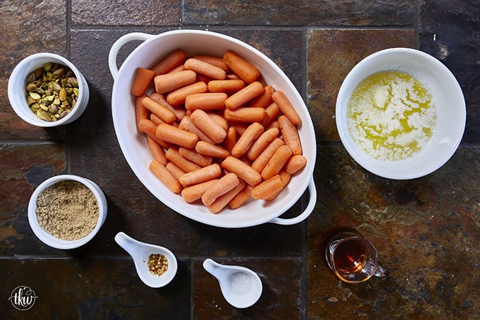 Turn ordinary carrots into something unforgettable! Roasted in a buttery, spiced maple sauce, then topped with toasted pistachios and a kiss of sea salt flakes, this side dish is guaranteed to steal the spotlight at any meal!
