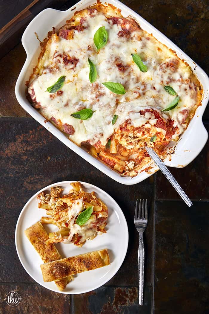When you need something warm, hearty, & comforting that everyone will love, this dish always hits the spot. Layers of rich marinara, tender ziti, creamy three-cheese ricotta filling, and zesty Italian sausage come together to create a bubbling, irresistibly cheesy dinner everyone will love.