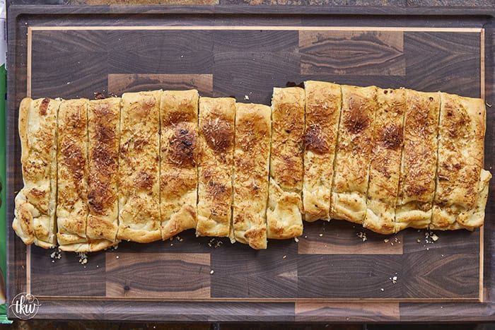 These cheese-stuffed breadsticks are the perfect blend of warm pizza dough, savory garlic butter, and gooey mozzarella for an irresistible bite! Made with simple pantry ingredients, they come together quickly for a delicious snack or the perfect side to any pizza or pasta night.