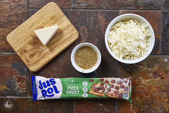 These cheese-stuffed breadsticks are the perfect blend of warm pizza dough, savory garlic butter, and gooey mozzarella for an irresistible bite! Made with simple pantry ingredients, they come together quickly for a delicious snack or the perfect side to any pizza or pasta night.
