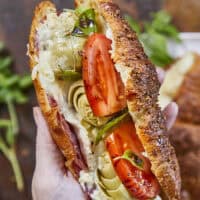 Buttery, flaky croissants stuffed with garlic butter spread, Boursin cheese, Italian meats, artichoke hearts, and mozzarella cheese. Topped with tomato slices, fresh basil, and a drizzle of balsamic glaze, they bake up perfectly golden, freeze beautifully, and are an easy Italian-inspired meal anytime!