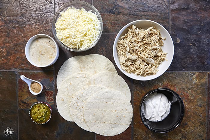 Creamy, comforting, and seriously easy, these white chicken enchiladas will immediately become a family favorite! Soft flour tortillas packed with well-seasoned chicken and cheeses, then smothered in the most decadent sour cream sauce. Perfect for a quick weeknight meal, meal prep, and freezer meals!