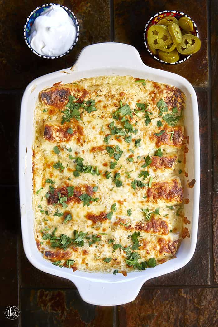 Creamy, comforting, and seriously easy, these white chicken enchiladas will immediately become a family favorite! Soft flour tortillas packed with well-seasoned chicken and cheeses, then smothered in the most decadent sour cream sauce. Perfect for a quick weeknight meal, meal prep, and freezer meals!