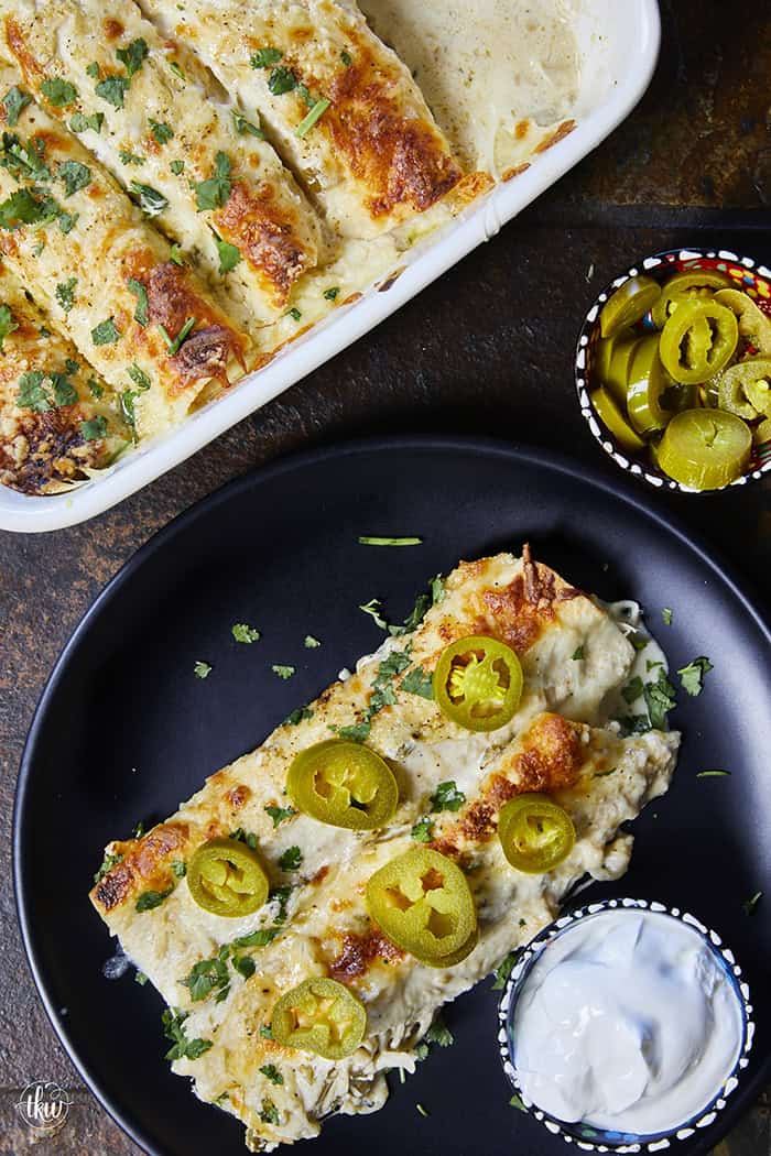 Creamy, comforting, and seriously easy, these white chicken enchiladas will immediately become a family favorite! Soft flour tortillas packed with well-seasoned chicken and cheeses, then smothered in the most decadent sour cream sauce. Perfect for a quick weeknight meal, meal prep, and freezer meals!