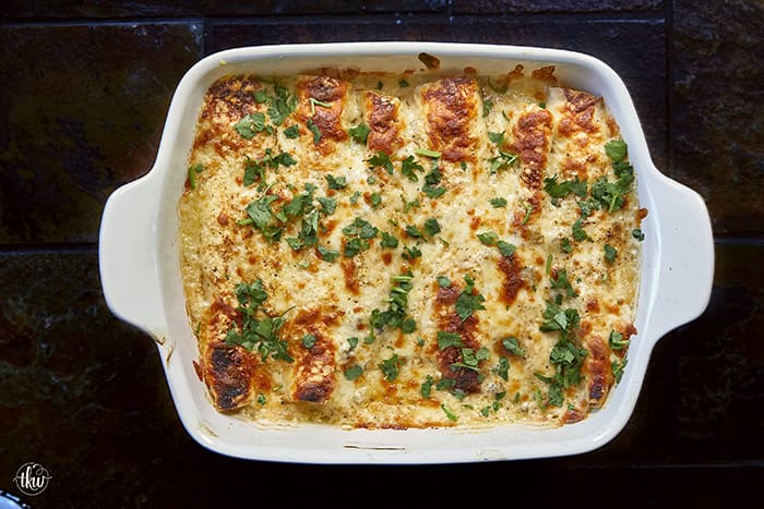 Creamy, comforting, and seriously easy, these white chicken enchiladas will immediately become a family favorite! Soft flour tortillas packed with well-seasoned chicken and cheeses, then smothered in the most decadent sour cream sauce. Perfect for a quick weeknight meal, meal prep, and freezer meals!