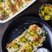 Creamy, comforting, and seriously easy, these white chicken enchiladas will immediately become a family favorite! Soft flour tortillas packed with well-seasoned chicken and cheeses, then smothered in the most decadent sour cream sauce. Perfect for a quick weeknight meal, meal prep, and freezer meals!