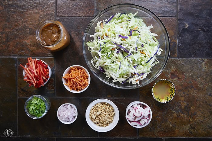 Fresh, crunchy, and bursting with bold flavor, this Thai-inspired Asian coleslaw features crisp cabbage, bell peppers, carrots, and crunchy peanuts all tossed in a creamy, spicy peanut butter dressing.