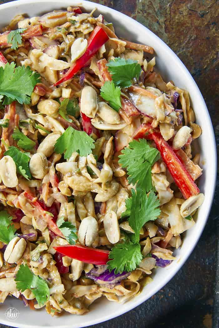 Fresh, crunchy, and bursting with bold flavor, this Thai-inspired Asian coleslaw features crisp cabbage, bell peppers, carrots, and crunchy peanuts all tossed in a creamy, spicy peanut butter dressing.