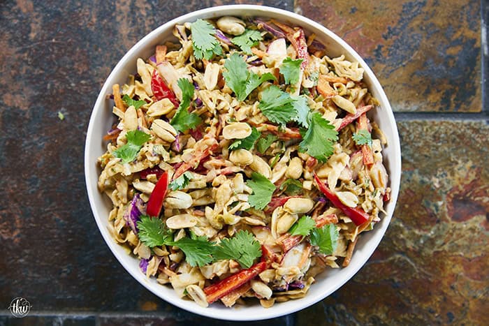 Fresh, crunchy, and bursting with bold flavor, this Thai-inspired Asian coleslaw features crisp cabbage, bell peppers, carrots, and crunchy peanuts all tossed in a creamy, spicy peanut butter dressing.
