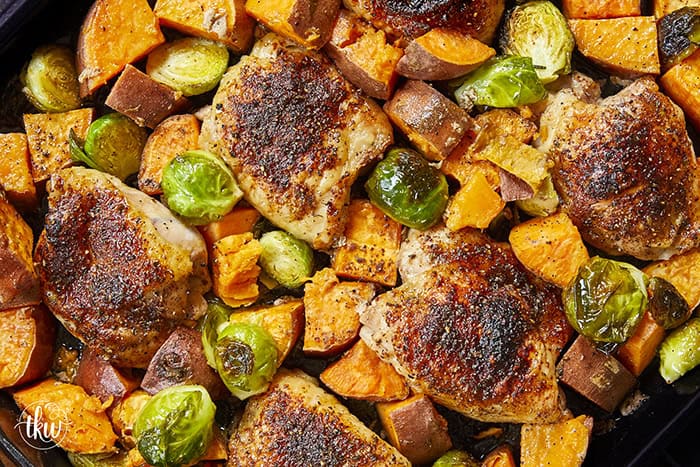 Crispy chicken thighs roast alongside caramelized sweet potatoes and Brussels sprouts for an easy, flavor-packed chicken dinner. The mango chipotle seasoning brings sweet heat and bold flavors, making this recipe perfect for busy weeknight dinners and simple meal prep.