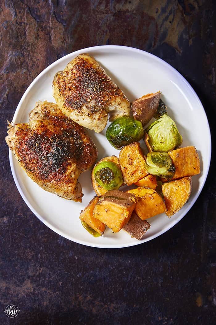 Crispy chicken thighs roast alongside caramelized sweet potatoes and Brussels sprouts for an easy, flavor-packed chicken dinner. The mango chipotle seasoning brings sweet heat and bold flavors, making this recipe perfect for busy weeknight dinners and simple meal prep.