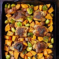 Crispy chicken thighs roast alongside caramelized sweet potatoes and Brussels sprouts for an easy, flavor-packed chicken dinner. The mango chipotle seasoning brings sweet heat and bold flavors, making this recipe perfect for busy weeknight dinners and simple meal prep.